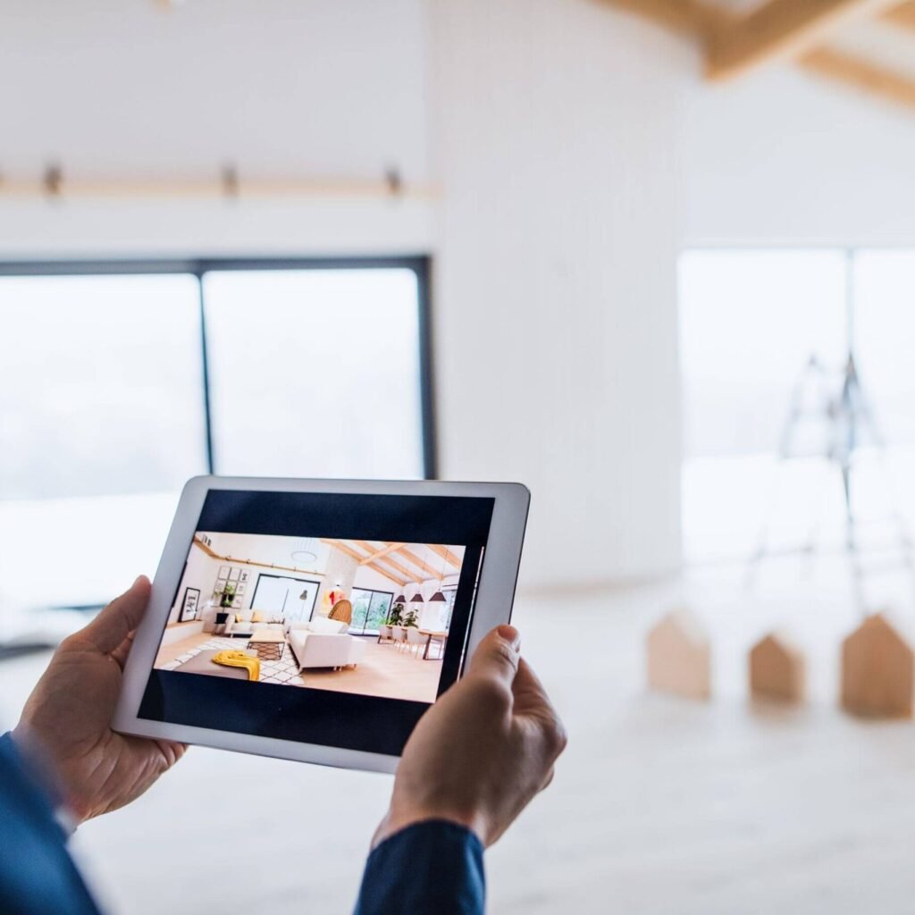 Midsection of man with tablet looking at interior a65egcr